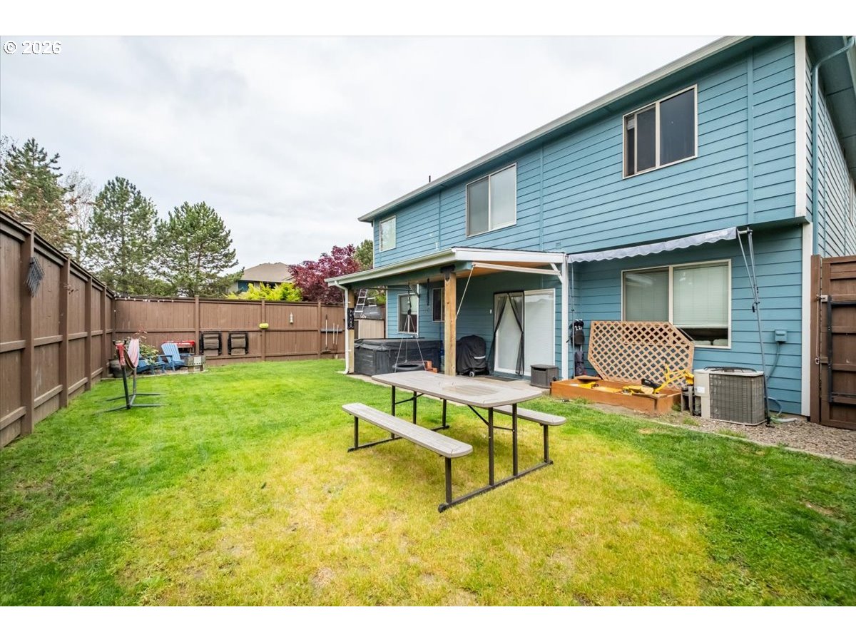 1000 Tasha Way Lebanon, OR 97355 - Photo 45 of 48 a view of an house with backyard porch and furniture