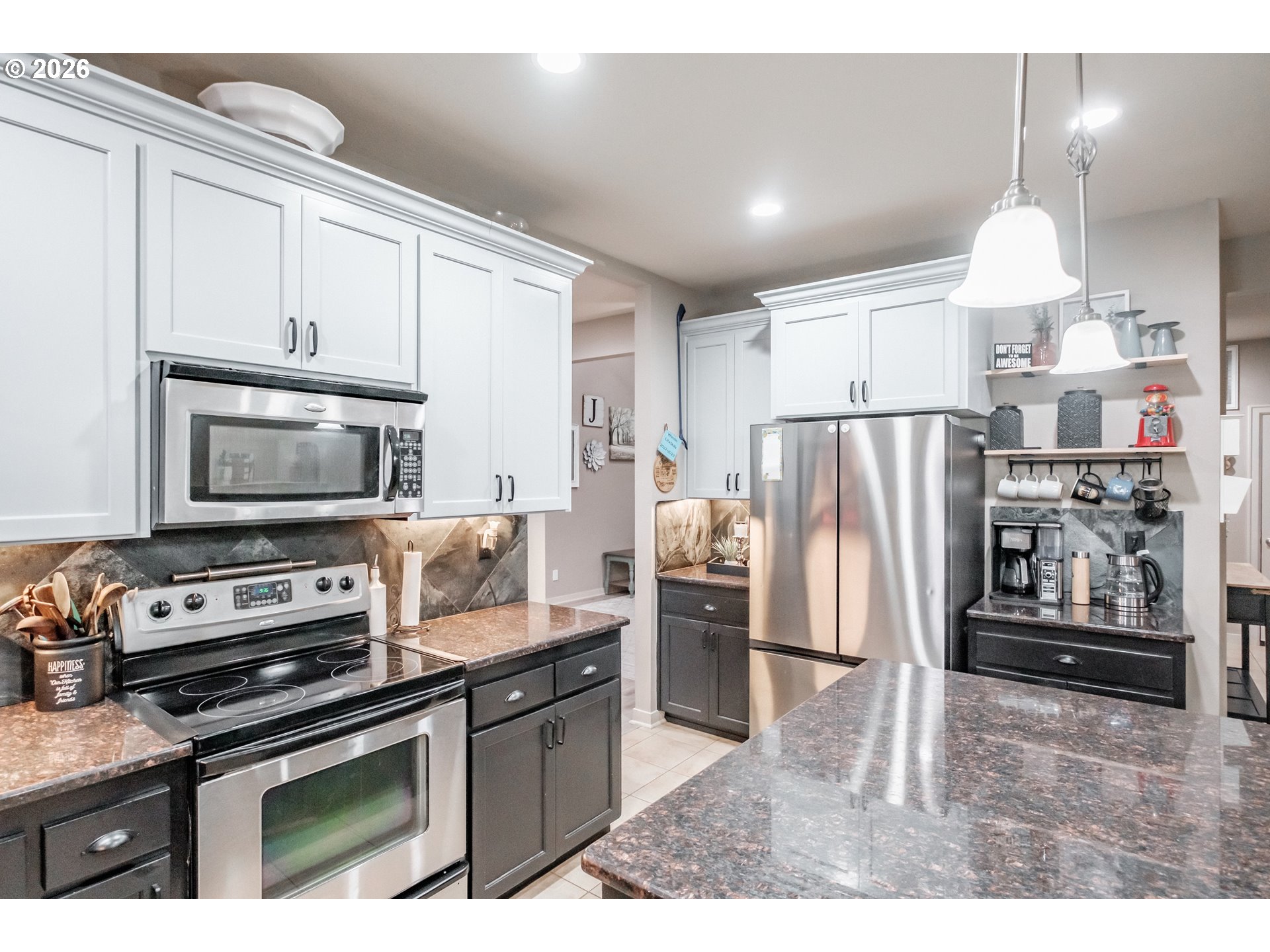 1000 Tasha Way Lebanon, OR 97355 - Photo 5 of 48 a kitchen with granite countertop a refrigerator stove and microwave