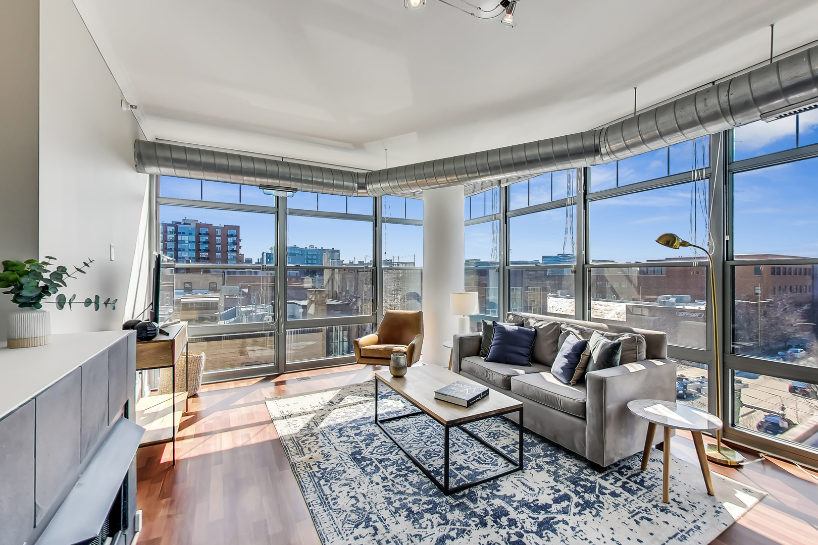 1200 West Monroe Street, Unit 511 Chicago, IL 60607 - Photo 2 of 12 a living room with furniture and a large window