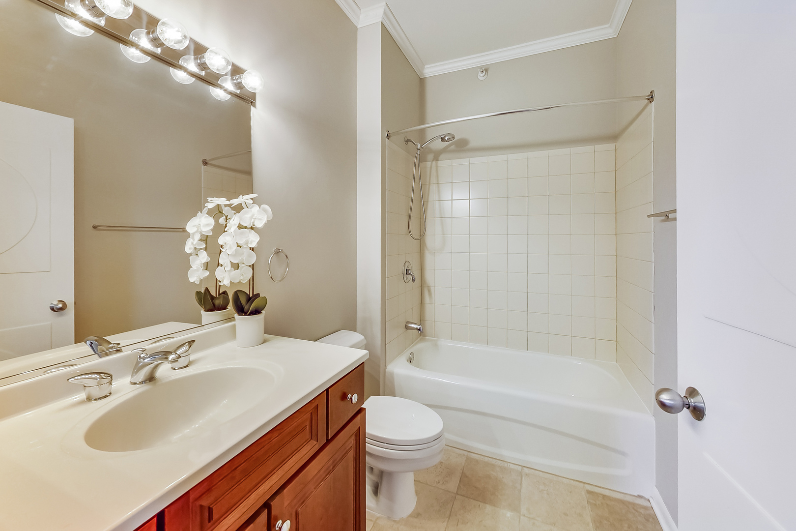 1200 West Monroe Street, Unit 511 Chicago, IL 60607 - Photo 10 of 12 a bathroom with a sink toilet tub and shower
