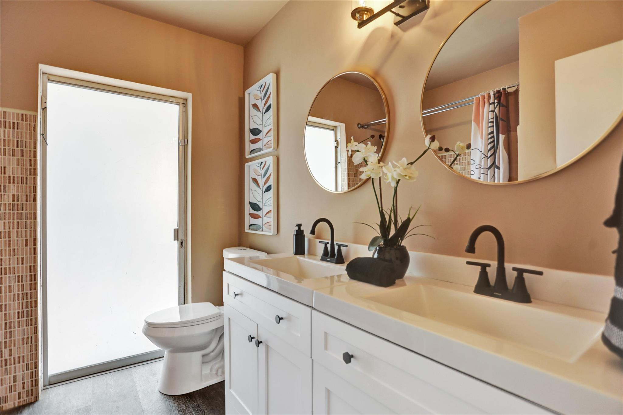 3828 East Shore Road Miramar, FL 33023 - Photo 15 of 33 a bathroom with a toilet sink and mirror