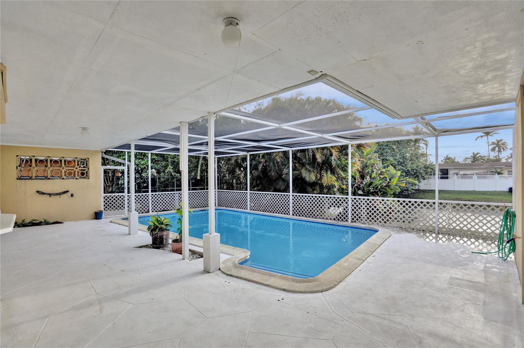 3828 East Shore Road Miramar, FL 33023 - Photo 23 of 33 a view of a swimming pool with a patio