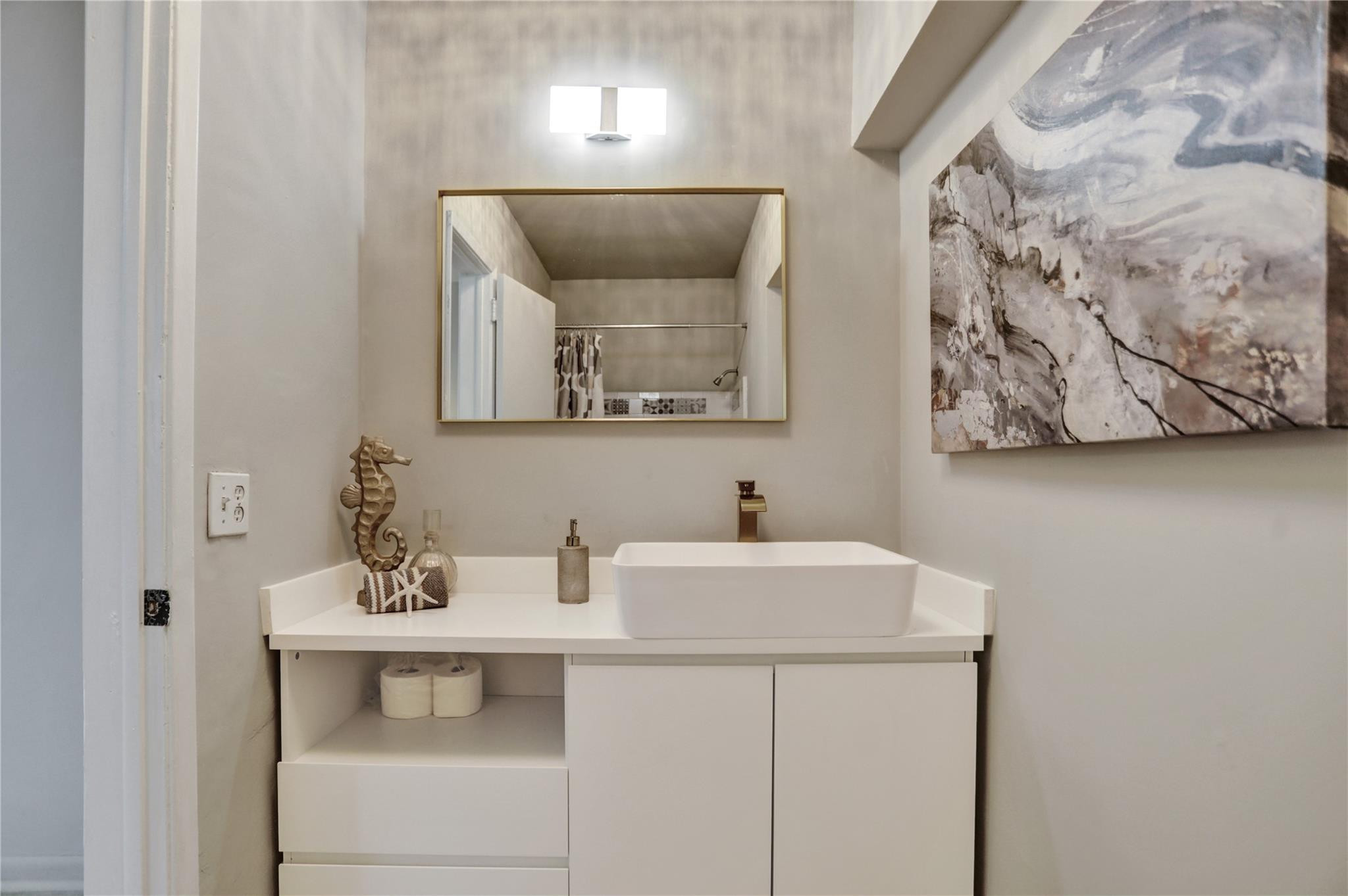 3828 East Shore Road Miramar, FL 33023 - Photo 30 of 33 a bathroom with a sink and a mirror