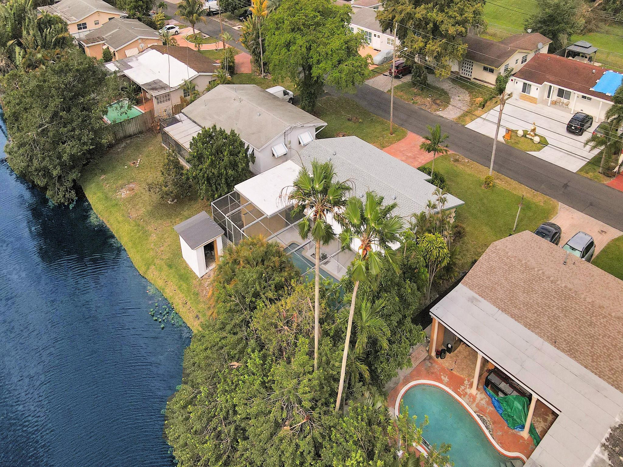 3828 East Shore Road Miramar, FL 33023 - Photo 33 of 33 an aerial view of a house with a yard