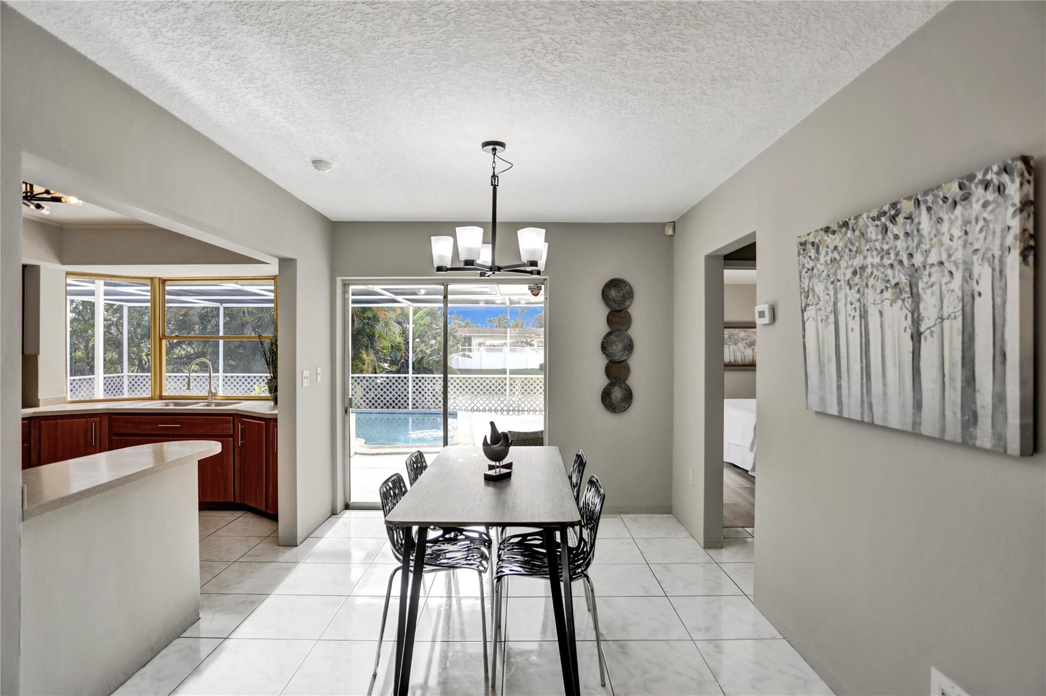 3828 East Shore Road Miramar, FL 33023 - Photo 8 of 33 a view of a dining room with furniture window and outside view