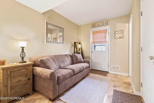 a living room with furniture and a window