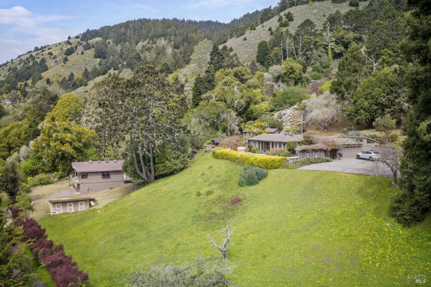 7500 Panoramic Highway Stinson Beach, CA 94970 - Photo 1 of 1 a view of a swimming pool with a yard