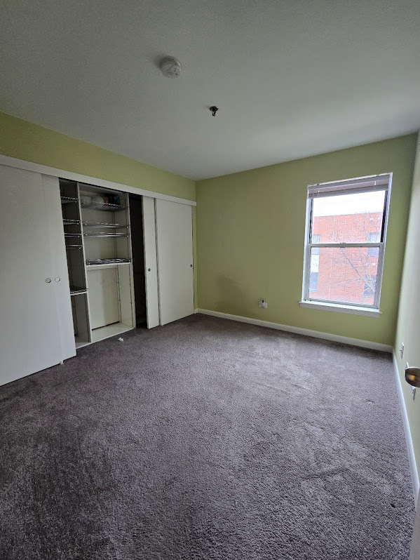 3255 Kirchoff Road, Unit 301 Rolling Meadows, IL 60008 - Photo 12 of 24 a view of an empty room with a window