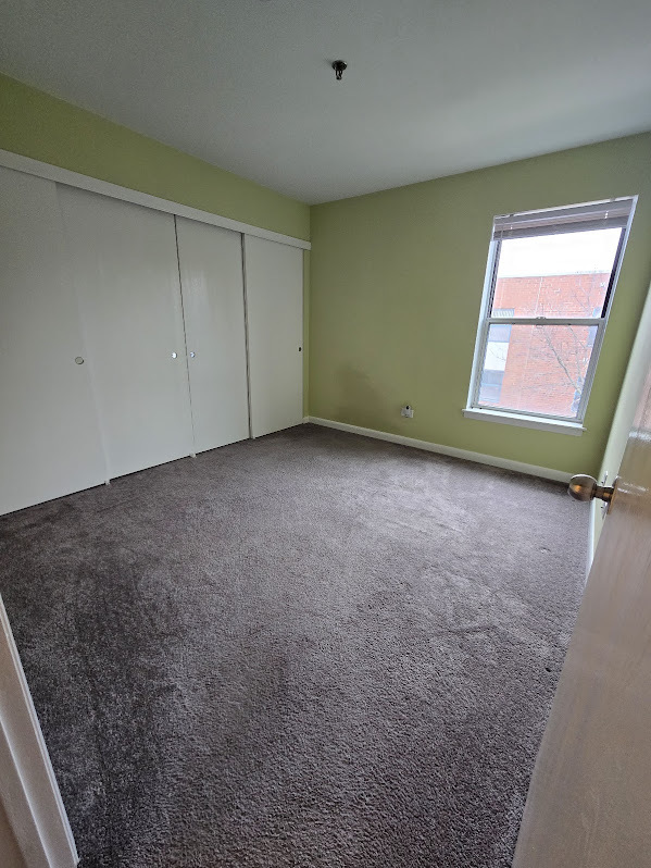 3255 Kirchoff Road, Unit 301 Rolling Meadows, IL 60008 - Photo 13 of 24 a view of an empty room with a window