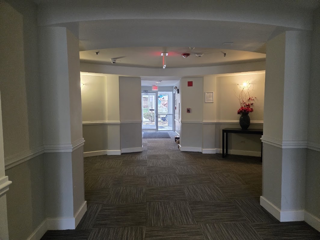 3255 Kirchoff Road, Unit 301 Rolling Meadows, IL 60008 - Photo 21 of 24 a view of a hallway with wooden shelves