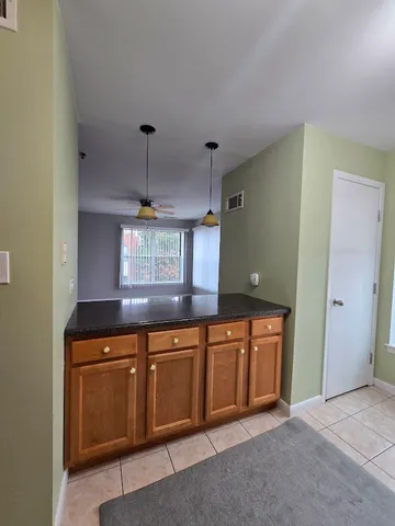 a kitchen with stainless steel appliances granite countertop a sink and cabinets