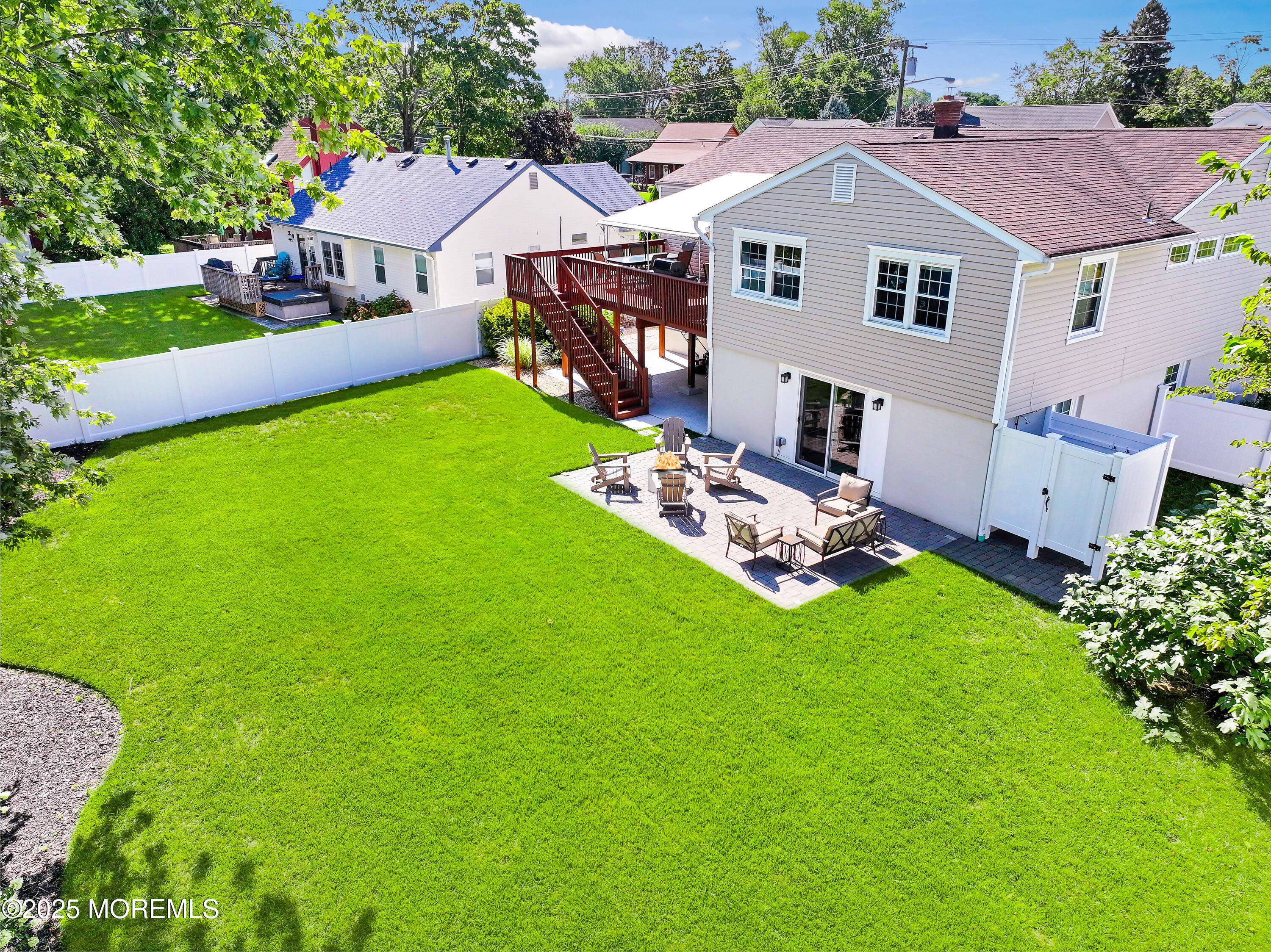 910 Ocean Road Spring Lake Heights, NJ 07762 - Photo 26 of 31 a aerial view of a house with a big yard potted plants and large tree