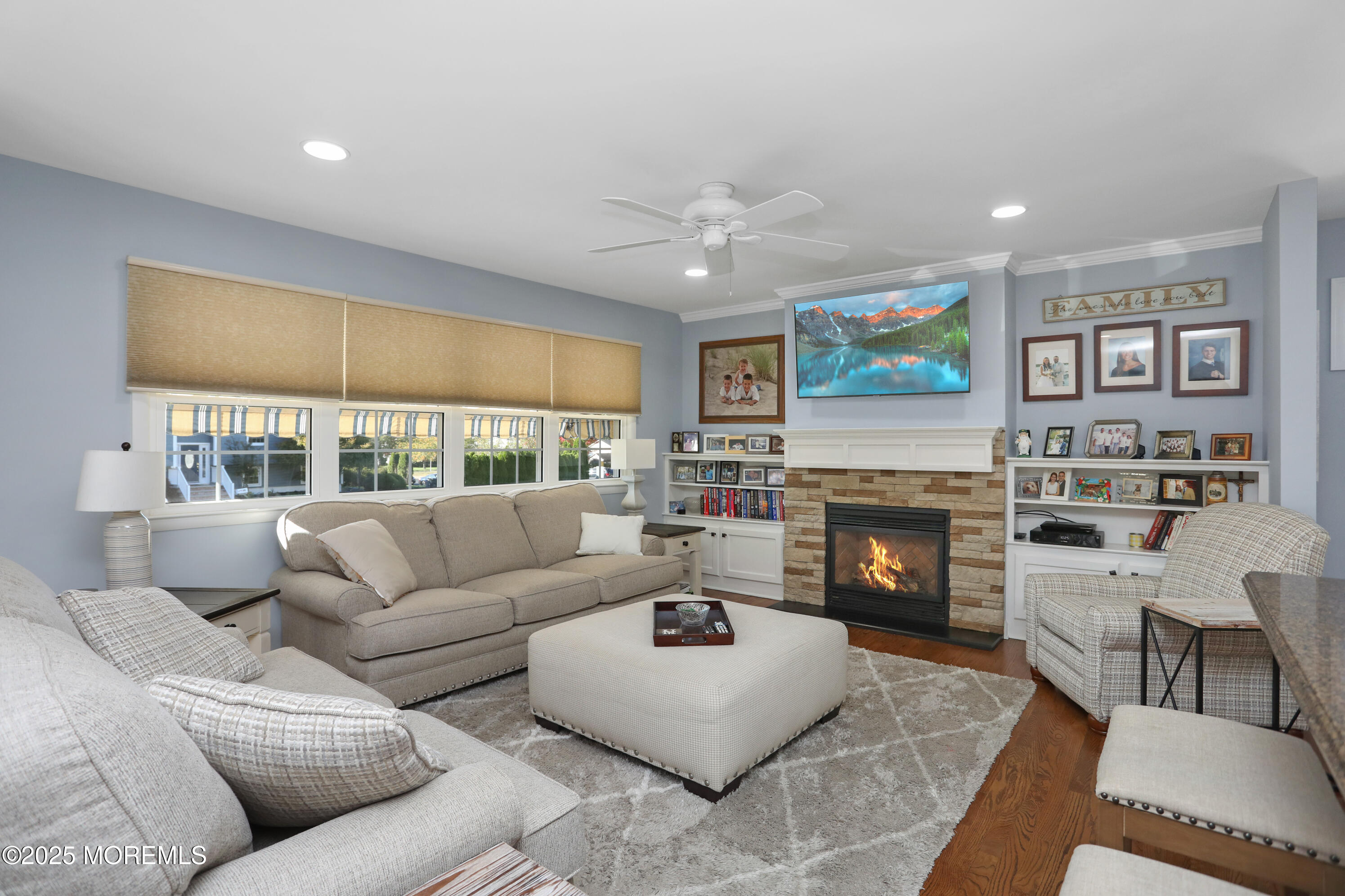 910 Ocean Road Spring Lake Heights, NJ 07762 - Photo 6 of 31 a living room with furniture and a fireplace