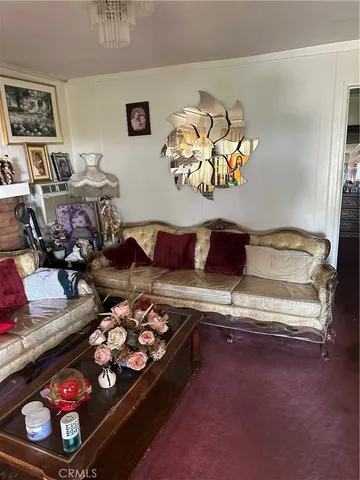 a living room with furniture and flowers