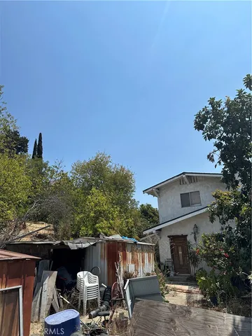 a front view of house with yard and seating