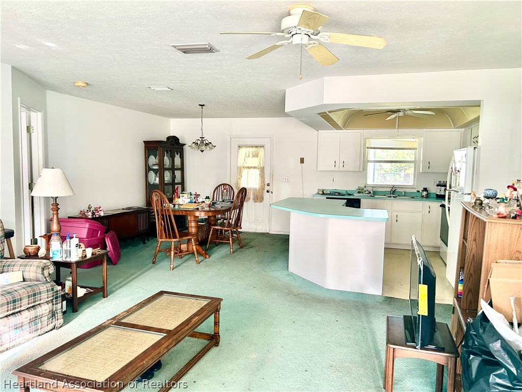 1927 North Morningside Road Avon Park, FL 33825 - Photo 2 of 5 a living room with furniture and kitchen view
