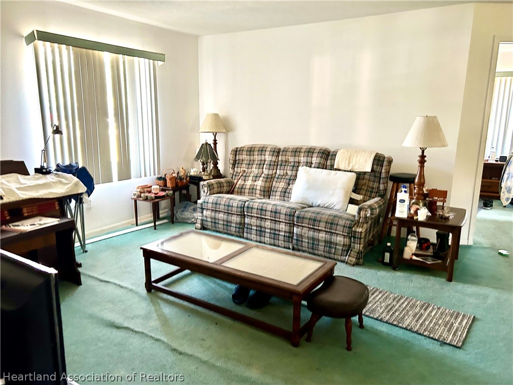 1927 North Morningside Road Avon Park, FL 33825 - Photo 3 of 5 a living room with furniture and a large window
