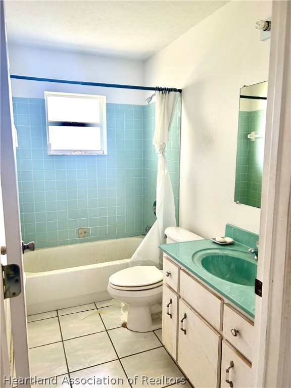 1927 North Morningside Road Avon Park, FL 33825 - Photo 4 of 5 a bathroom with a granite countertop sink toilet and shower