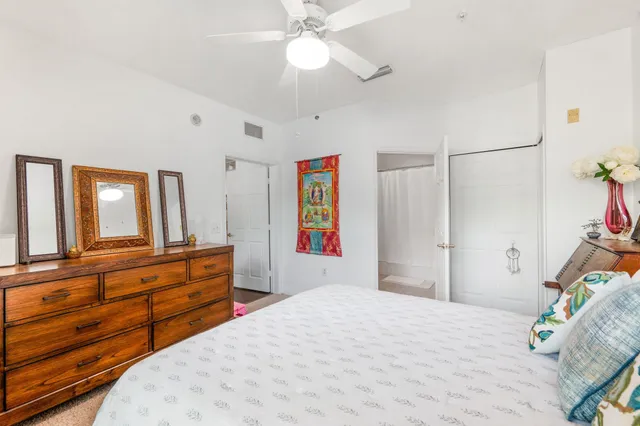 a bedroom with a bed and a dresser