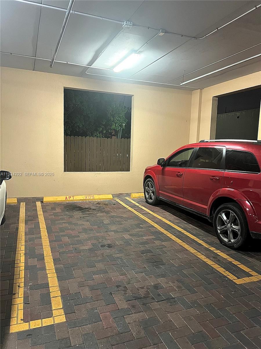1253 Southwest 2nd Street, Unit 209 Miami, FL 33135 - Photo 9 of 11 a car parked in a parking garage