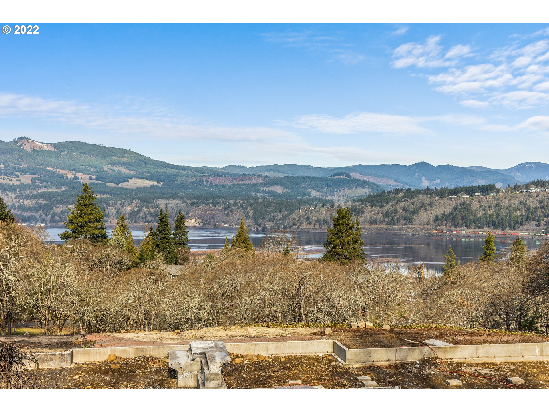 515 Highline Road Hood River, OR 97031 - Photo 21 of 32 a view of a lake with a mountain