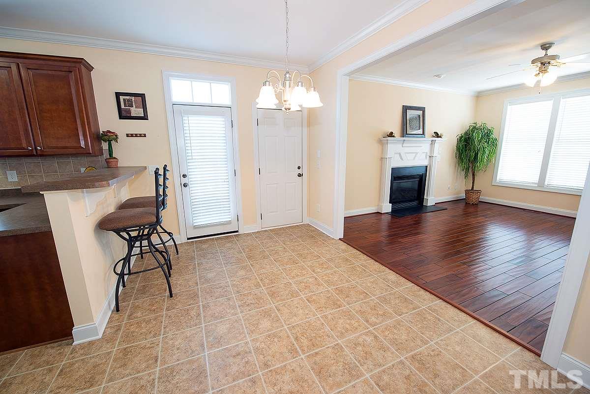 5005 Contender Drive Raleigh, NC 27603 - Photo 6 of 21 a view of a livingroom with furniture and a ceiling fan