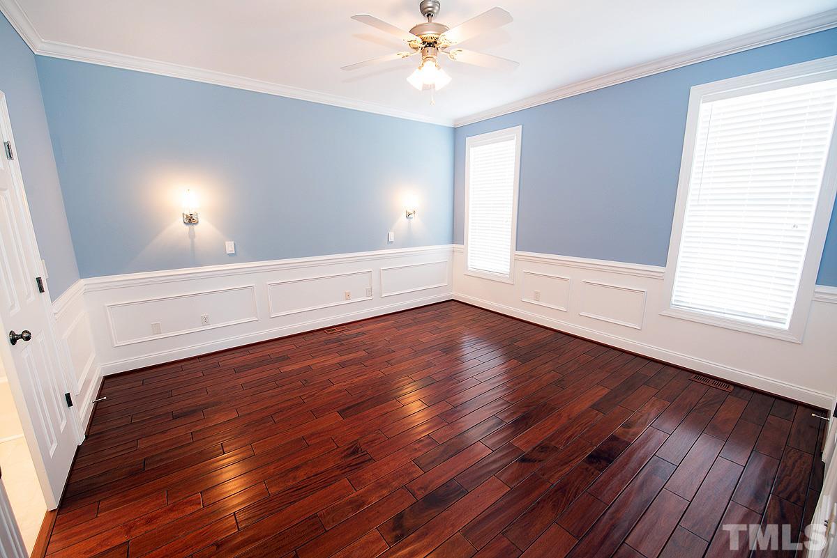 5005 Contender Drive Raleigh, NC 27603 - Photo 10 of 21 wooden floor in an empty room with a window