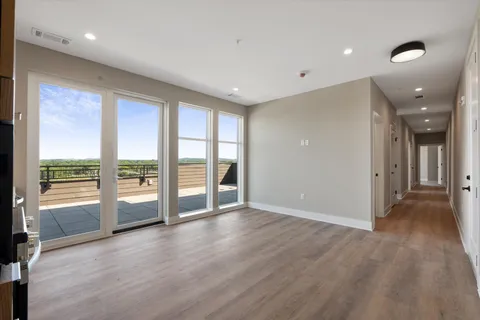a view of entryway with wooden floor