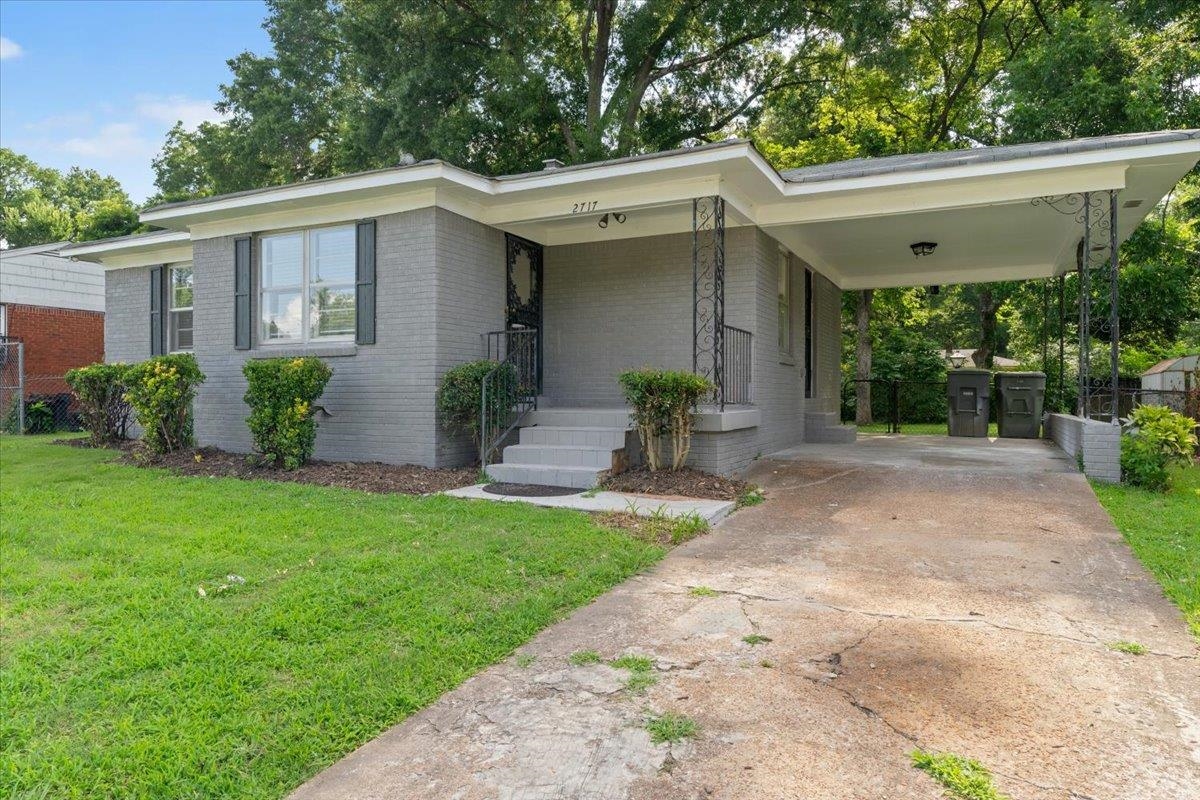 2717 Merle Street Memphis, TN 38118 - Photo 13 of 18 Brick exterior with a carport and concrete driveway