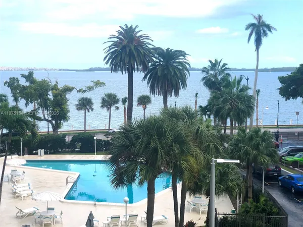 a view of outdoor space with palm trees