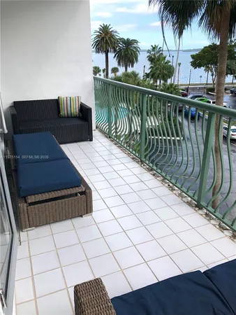 a view of balcony with furniture