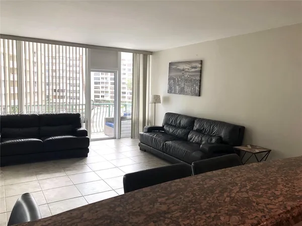 a kitchen with granite countertop a sink appliances and cabinets