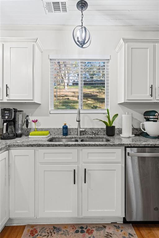 3675 Rosedale Circle Gainesville, GA 30506 - Photo 12 of 32 a kitchen with granite countertop white cabinets white appliances a sink and a window