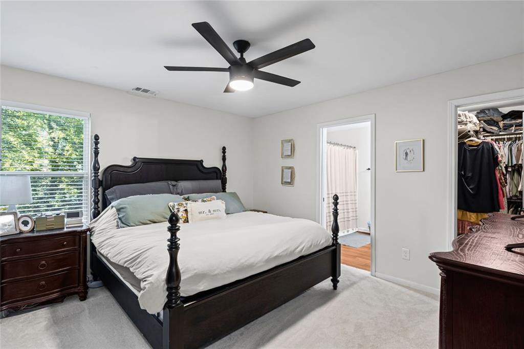 3675 Rosedale Circle Gainesville, GA 30506 - Photo 15 of 32 a bedroom with a bed and a flat tv screen on the dresser