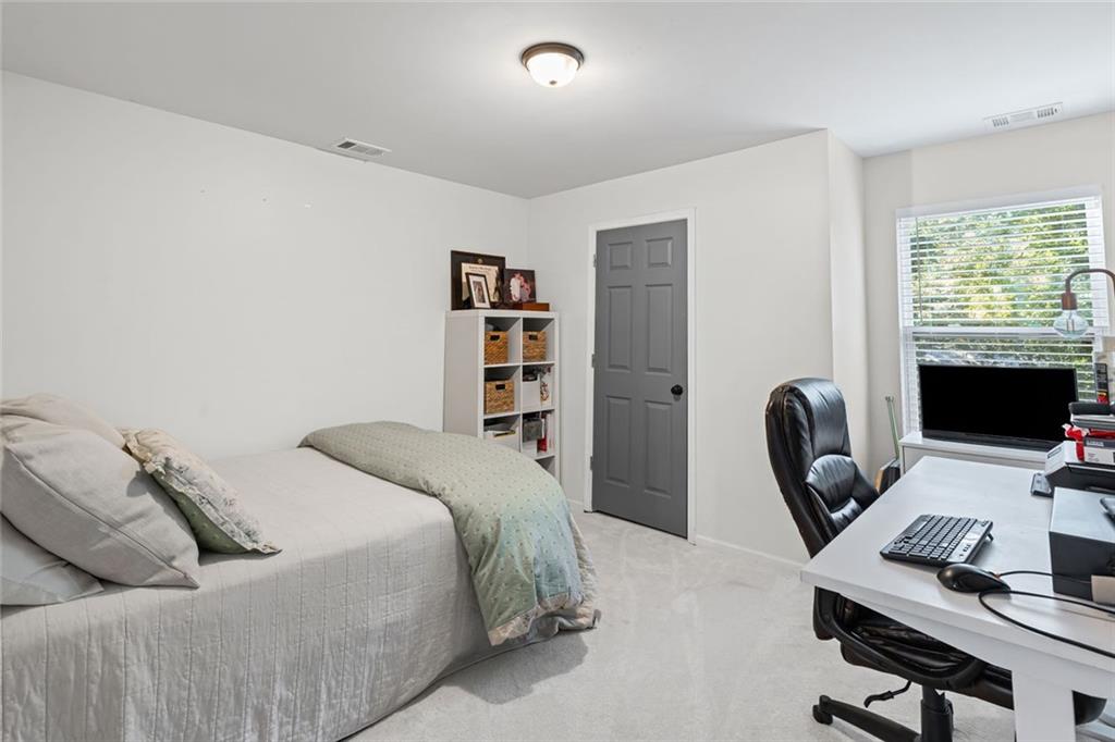 3675 Rosedale Circle Gainesville, GA 30506 - Photo 16 of 32 a bedroom with a bed and a desk