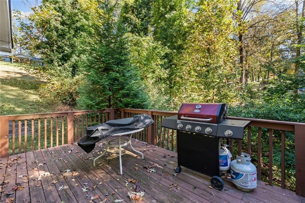 3675 Rosedale Circle Gainesville, GA 30506 - Photo 28 of 32 a view of a chairs and table on the wooden roof deck
