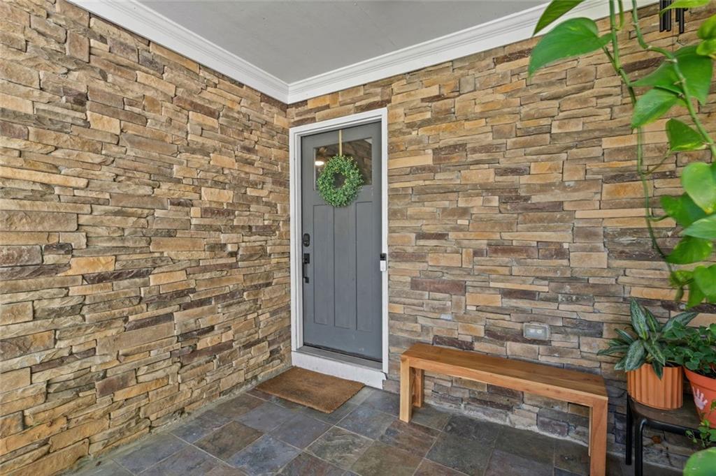 3675 Rosedale Circle Gainesville, GA 30506 - Photo 4 of 32 a brick building with a bench in front of door