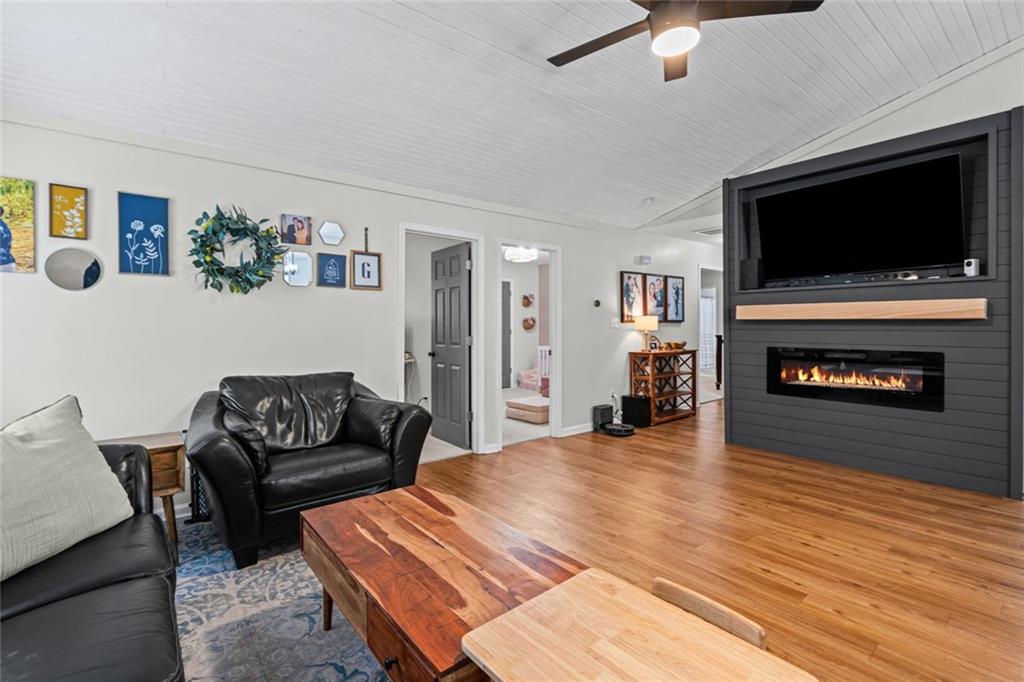 3675 Rosedale Circle Gainesville, GA 30506 - Photo 10 of 32 a living room with furniture and a flat screen tv