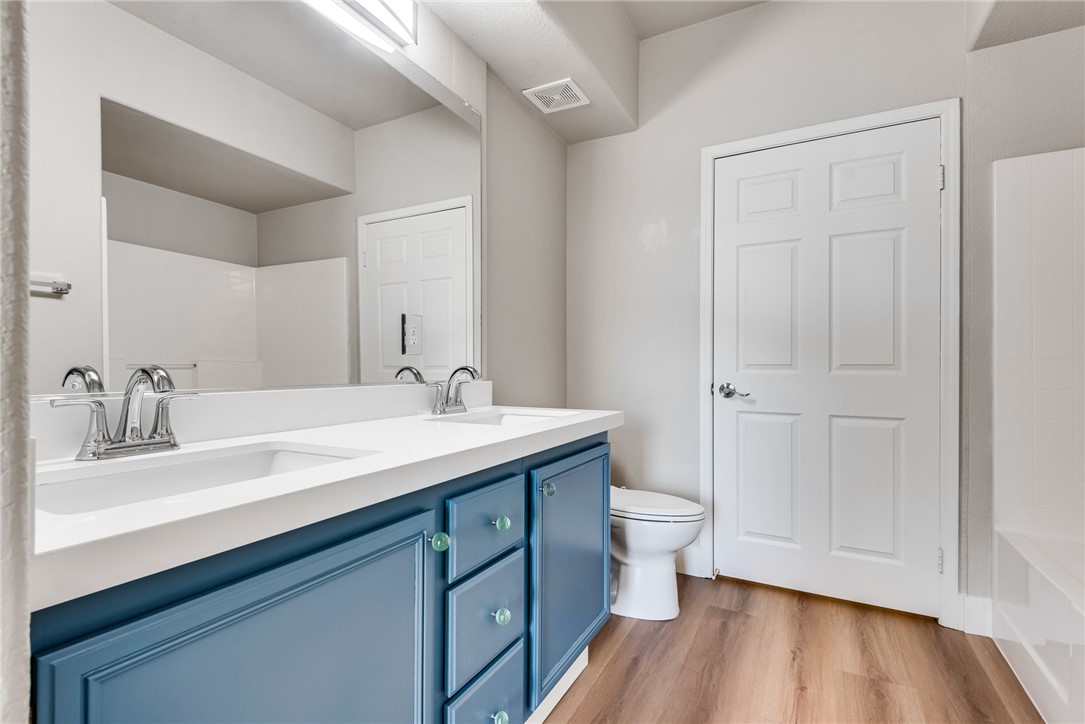 10550 West Alexander Road, Unit 2174 Las Vegas, NV 89129 - Photo 17 of 28 A stylish vanity with dual sinks anchors this modern and functional bathroom space.