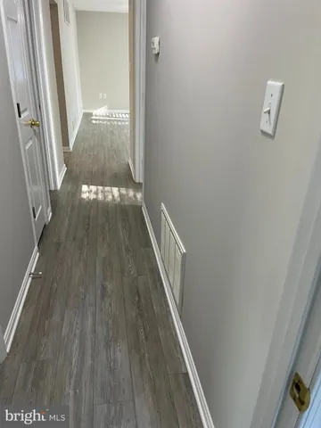 a view of balcony with wooden floor