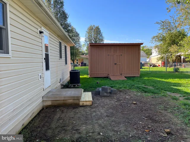 a view of a back yard of the house