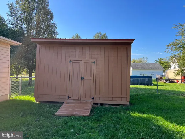 a view of a backyard with a barn