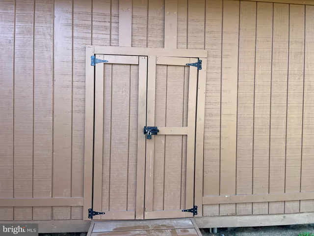 a view of a utility room with a wooden door