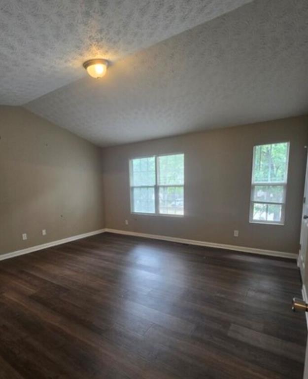 2881 Norfair Loop Lithonia, GA 30038 - Photo 5 of 5 an empty room with wooden floor and windows