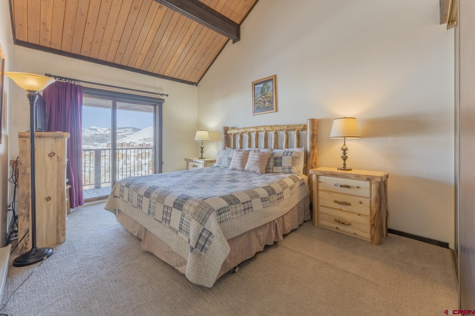 18 Hunter Hill Road, Unit J304 Crested Butte, CO 81225 - Photo 13 of 40 a bed room with a bed and a window