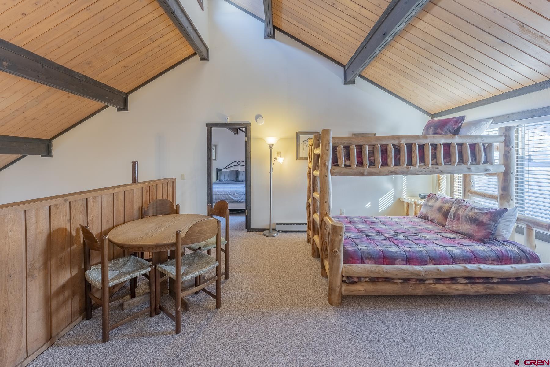 18 Hunter Hill Road, Unit J304 Crested Butte, CO 81225 - Photo 24 of 40 a bedroom with furniture and a window