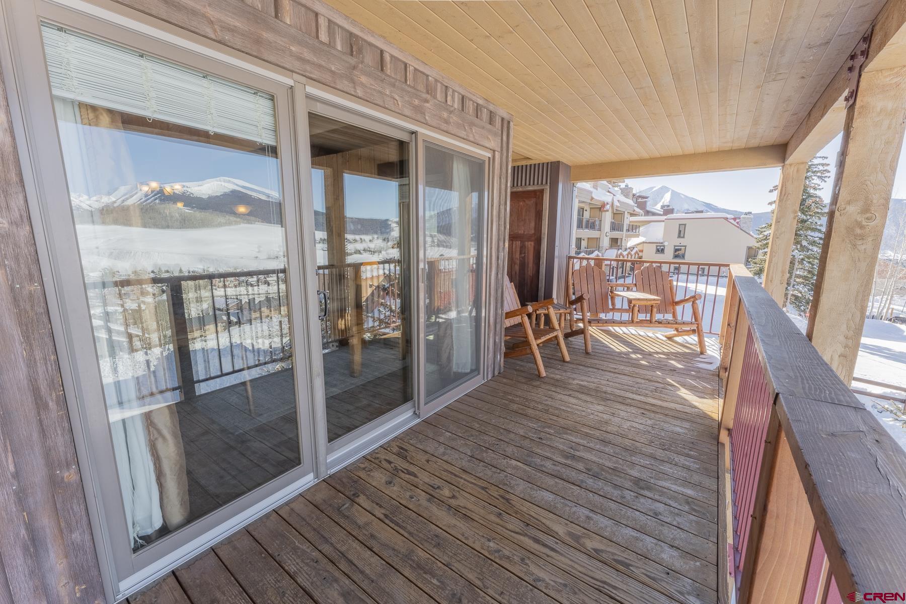 18 Hunter Hill Road, Unit J304 Crested Butte, CO 81225 - Photo 28 of 40 a view of a balcony with wooden floor
