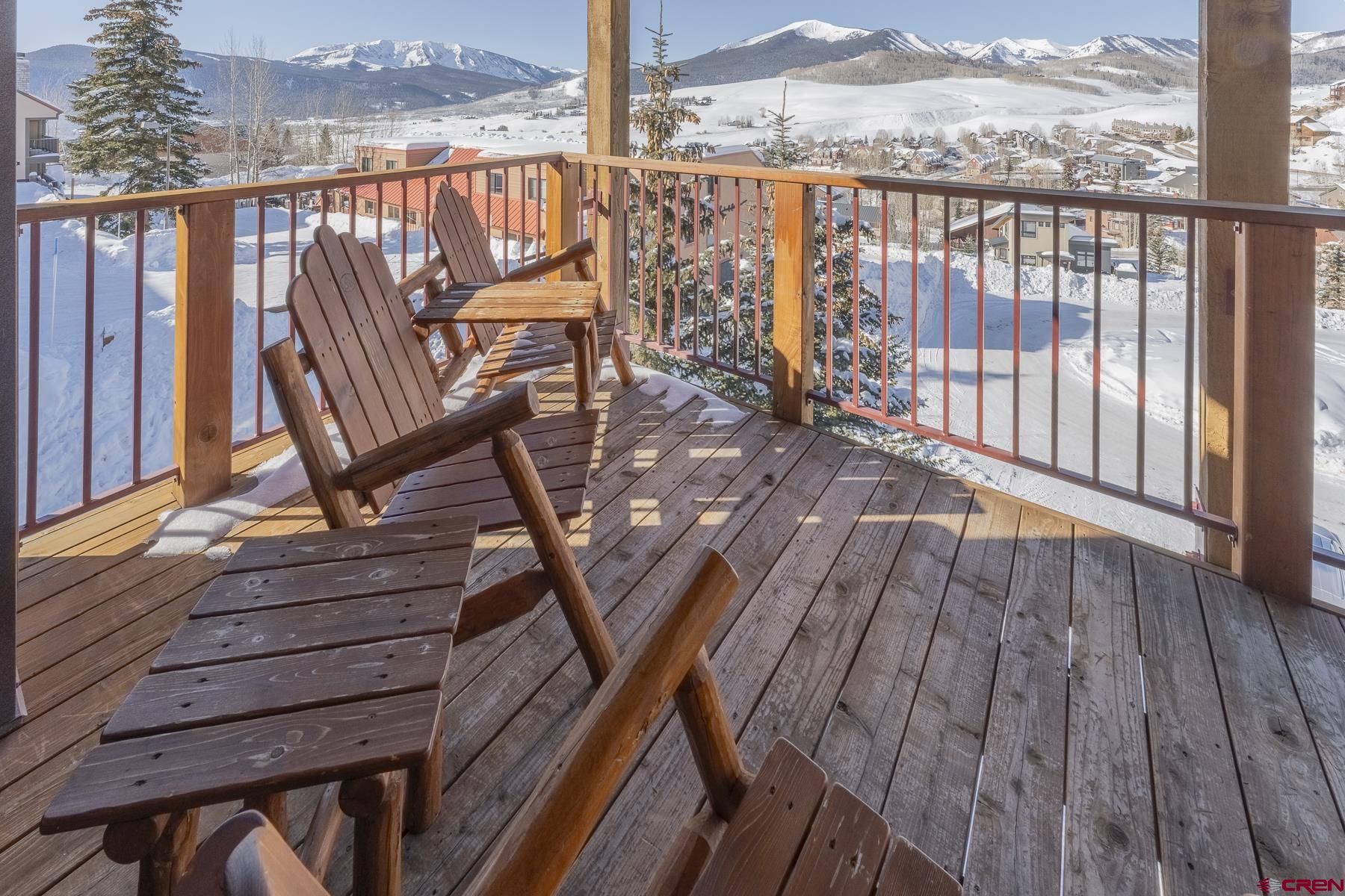 18 Hunter Hill Road, Unit J304 Crested Butte, CO 81225 - Photo 29 of 40 a balcony with wooden floor