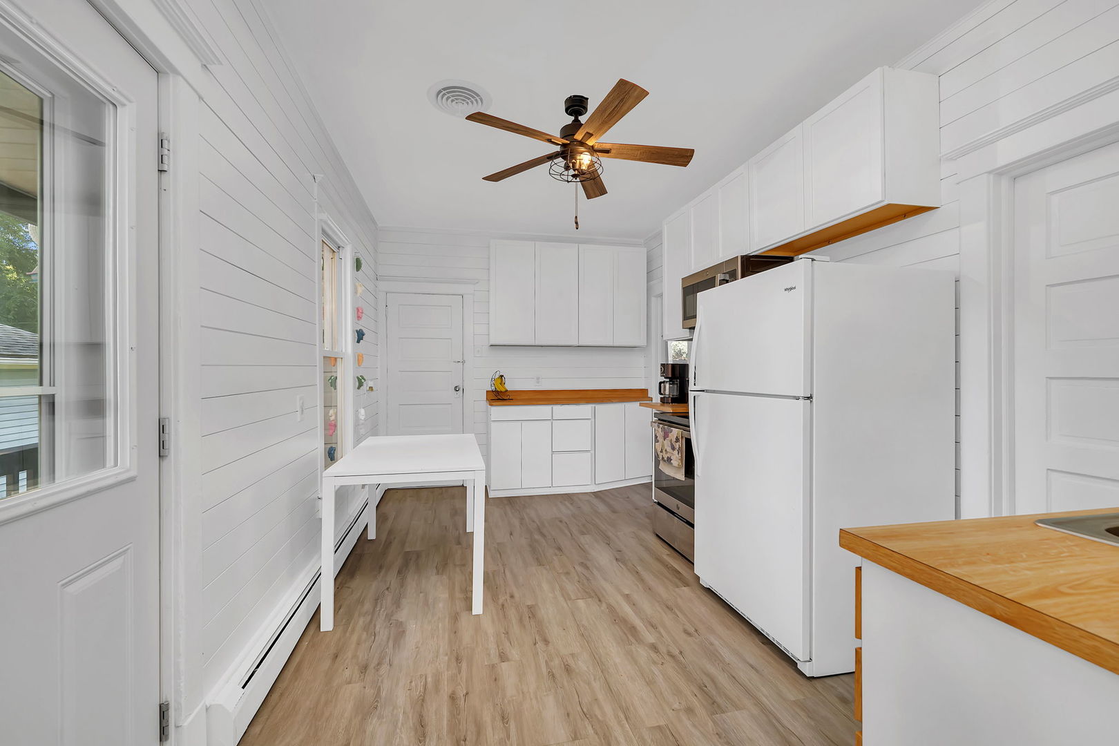 1122 Grant Street Morris, IL 60450 - Photo 13 of 25 a kitchen with a refrigerator a sink and cabinets