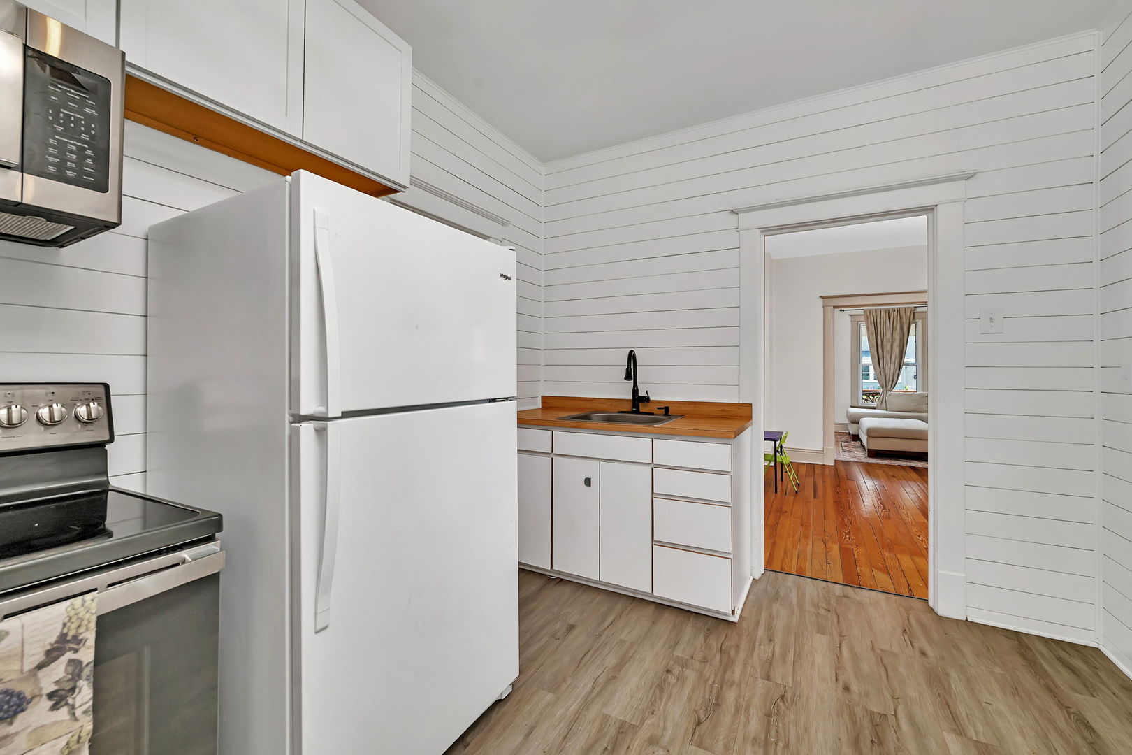1122 Grant Street Morris, IL 60450 - Photo 16 of 25 a kitchen with white cabinets and stainless steel appliances